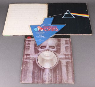 A collection of vinyl records to include A novelty Thompson Twins "Sister of Mercy" record shaped like a marrow, Public Image Limited "Religion Attack", Pink Floyd "The Wall", "Medal" and "Dark Side of The Moon", Black Sabbath "Paranoid" and "Brain Salad Surgery" 