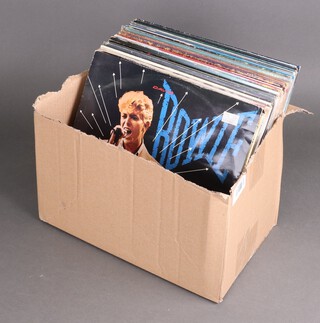 A collection of vinyl records to include Bowie, Robert Palmer, Midge Ure, Moody Blues, Roxy Music, UB40, Mike Oldfield, 