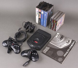 A Sega Multi-Mega (portable Mega CD) with games - Jaguar XJ220, Lethal Enforcers II and The Sega Classics Arcade Collection, together with Mega-Drive games - Rise of The Robots, PGA Tour '96, Kawasaki Super Bikes and Mohammed Ali Heavy Weight Boxing, with instructions, 2 controllers, power supply and RF cables, all fully tested and working 