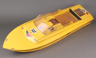 A large wooden RC Kyosho model speed boat 