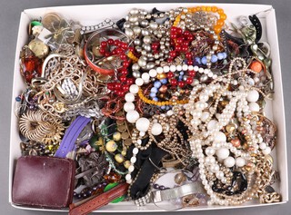 A collection of costume jewellery including beads, brooches, bangles, wristwatches etc 