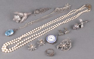 A silver filigree brooch, a double strand pearl necklace with 9ct gold clasp, an enamelled wristwatch (no strap) and other items