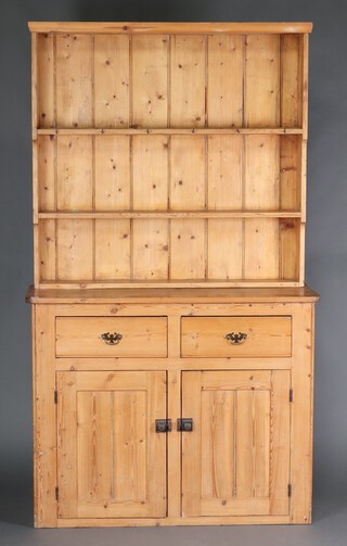 A Victorian pine dresser the base fitted drawers above double cupboard 209cm h x 122cm w x 44m d 