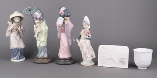Three Lladro figures of Geishas, one other Lladro figure, a Lladro tea light holder and collectors society table sign