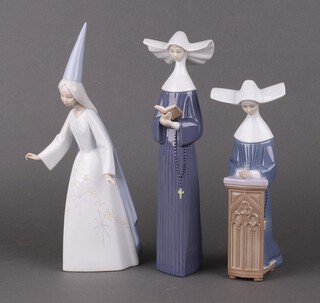 Two Lladro figures of nuns and one other Lladro figure