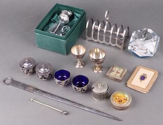 A silver plated toast rack, meat skewer, condiment set, 2 white metal boxes decorated hunting scenes, etc