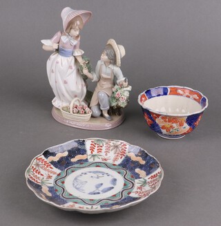 A Lladro figure of a girl and boy gathering flowers 5453 20cm and other items of decorative china 