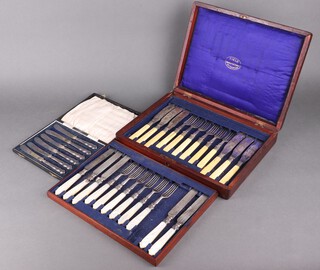 A cased set of 6 silver handled butter knives together with a canteen of fish knives and forks