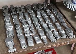 A collection of pewter Danbury Mint model cars 