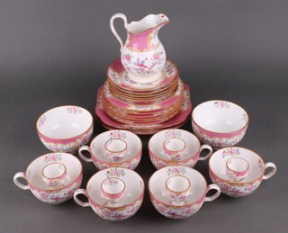 A Mintons pottery part tea set decorated with pink floral banding