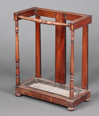 A Victorian mahogany umbrella stand with pressed metal drip tray 77cm h x 63cm w x 17cm d (bar to front a/f, 1 foot loose) 