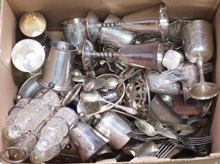 A large quantity of silver plated items including a cruet set, goblets, sauce boat, cutlery, etc