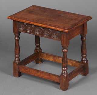 A rectangular carved oak joined stool on turned and block supports 45cm h x 51cm w x 30cm d 
