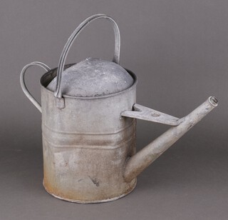 A 1930's galvanised steel watering can (dented)  