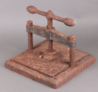 An iron book press (very rusted) 