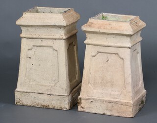 A pair of hollow pottery plinths decorated chamfered recessed panels 