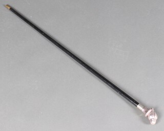 An ebonised walking cane, the silver mounted  handle in the form of a bird  