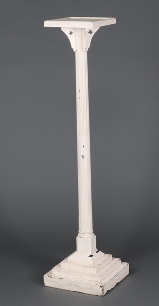 A square white painted pedestal on turned and fluted column with square stepped base 61cm h 