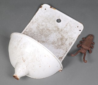A Continental white enamelled wall planter 58cm h x 37cm w together with a cast iron book jack in the form of a beetle 