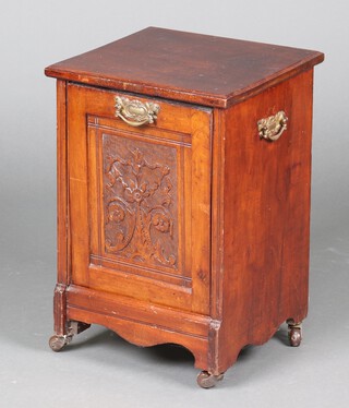 An Edwardian carved walnut coal purdonium with fall front 64cm x 37cm x 35cm 