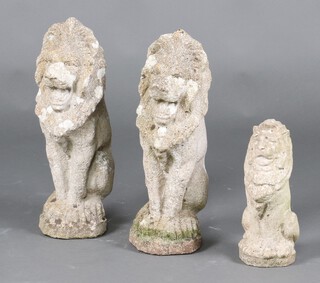 Two well weathered figures of seated lions 53cm and 1 other 