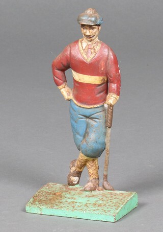 A cast iron door stop in the form of a standing golfer 24cm h 