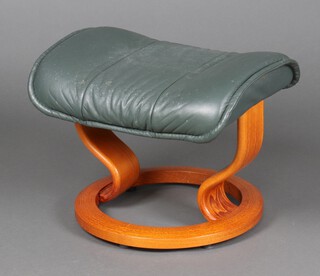 A "Stressless" style beech framed footstool in green leather 38cm h x 51cm w x 37cm d  