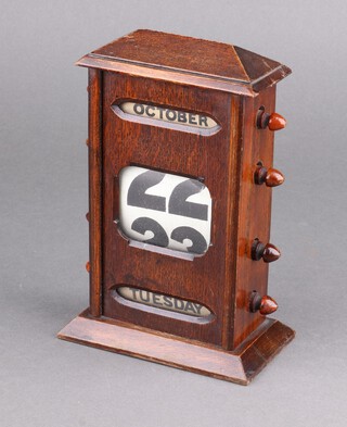 An Edwardian perpetual calendar contained in an oak case 20cm h x 14cm w x 7cm d 