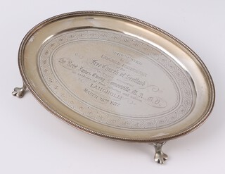A Victorian Scottish oval silver salver Edinburgh 1871, engraved inscription "Presented by The Langholm Congregation of The Free Church of Scotland ... March 28th 1872", 200 grams 