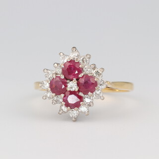 An 18ct yellow gold ruby and diamond cluster ring, the 4 rubies approx. 0.15ct each, 17 diamonds each approx. 0.03ct, size O 1/2, 4.1 grams