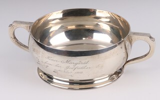 A silver twin handled bowl/quaich with engraved inscription, Birmingham 1918, maker Deakin and Francis Ltd. 210 grams 