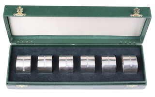 A set of 6 silver napkin rings Sheffield 1999 with millennium hallmark, maker United Cutlers, 196 grams, in presentation case  