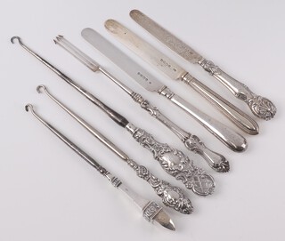 A Georgian silver handled pickle fork Sheffield 1832, 2 Victorian silver bladed fruit knives and 3 silver handled button hooks