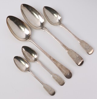 A Georgian silver Old English pattern table spoon London 1792, maker Peter and Anne Bateman, a fiddle pattern table spoon London 1807, maker Thomas Wilkes Barker, a Georgian silver pudding spoon, 2 Georgian silver fiddle pattern teaspoons, 224 grams 