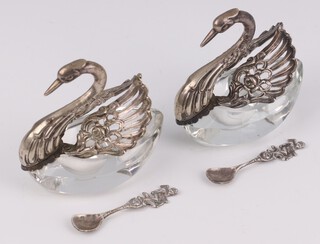 A pair of German cut glass and pierced silver salts in the form of swans 7cm with spoons