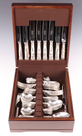 An 80 piece matched silver canteen of Queens Pattern flatware of mixed dates, comprising 4 table spoons, 8 dinner knives, 9 dinner forks, 8 soup spoons, 8 pudding spoons, 8 pudding forks, 6 fruit spoons, 6 fruit forks, 8 teaspoons, 6 coffee spoons, bread knife, cheese, knife, 8 tea knives, maker United Cutlers, Sheffield 1991, 1993, 1994, 1996 and 1997, weighable silver 3796 grams, the knives including weighted handles 1384 grams, contained in a mahogany canteen box  
