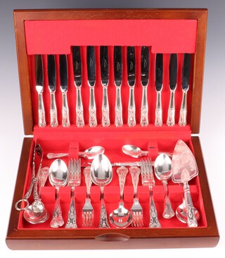A 45 piece silver plated canteen of Queens Pattern flatware to include 2 serving spoons, 6 soup spoons, 6 dinner knives, 6 dinner forks, 6 pudding spoons, 6 pudding forks, 6 tea knives, 6 teaspoons and a cheese knife, together with a serving knife and a pair of sandwich tongs, all contained in a mahogany canteen box, maker Newbridge Cutlers, 