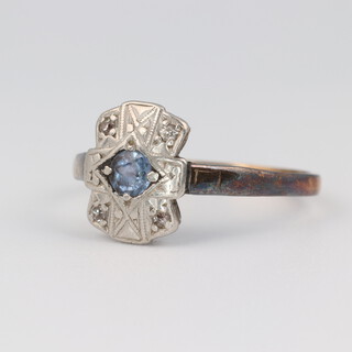 An Edwardian 9ct yellow gold sapphire and diamond cluster ring, the centre sapphire approx. 0.01ct surround by illusion set diamonds, size J 1/2, 1.7 grams 