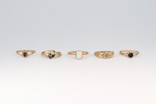 Five 9ct yellow gold gem set rings (1 cut), sizes N, O, O, O and O 1/2, gross weight 7 grams 