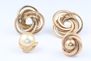 A pair of 9ct yellow gold whorl earrings and 2 single earrings, 3 weighable earrings 4.32 grams 
