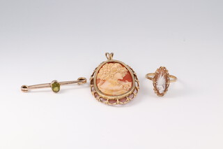 A 9ct yellow gold cameo ring size N, a ditto mounted pendant brooch and a stick pin, gross weight 9.8 grams 