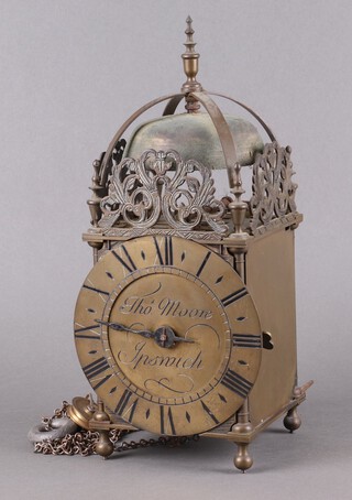 A 19th Century copy of a 17th Century striking, single handled, brass lantern clock, the dial marked Thomas Moore of Ipswich, 16cm, complete with pendulum and key 