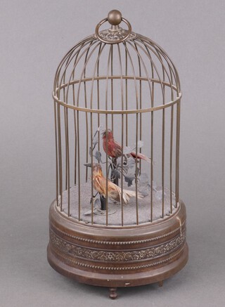 A 1960's reproduction Victorian singing bird automaton in the form of 2 caged birds 26cm x 14cm 