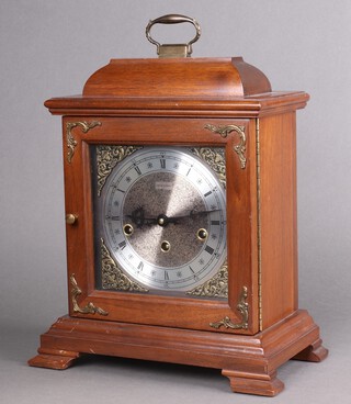 A West German 8 day chiming bracket clock with 27cm silvered dial and chapter ring, the back plate marked Hamilton 1050-202, contained in a mahogany case 31cm h x 30cm w 