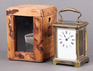 A 19th Century carriage timepiece with 5.5cm enamelled dial, Roman numerals contained in a gilt metal case complete with key and leather carrying case