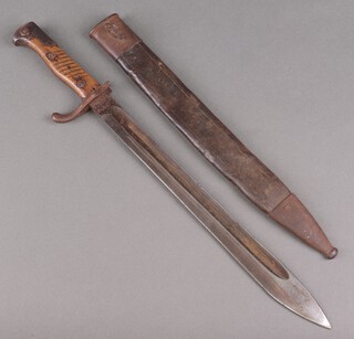 A First World War German Mauser bayonet with leather scabbard, the blade marked Alex Coppel Solingen, the cross bar and leather scabbard marked B1.A.F.10.H1Z 