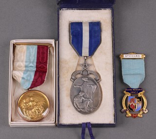 A Masonic gilt metal charity jewel with 9ct gold band, a silver Royal Masonic hospital Life Governor's jewel, a 1949 Royal Masonic Institute for Boys gilt and enamel jewel 