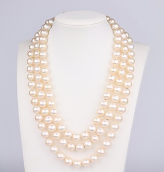A 3 strand cultured pearl necklace, each approx, 7mm, with a 14ct  gold pearl set clasp, 40cm 