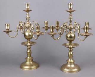 An impressive pair of 18th Century Dutch style brass 5 light candelabrum raised on circular bases 45cm h x 34cm, each arm and centre numbered 1-3 
