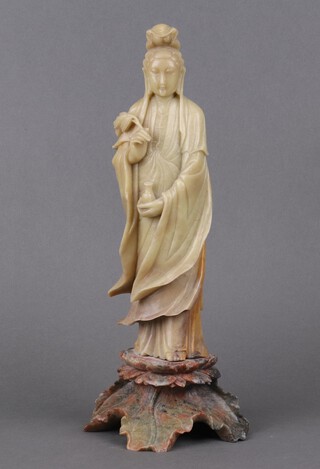 A 19th Century carved green soap stone figure of a standing Quan Li, 35cm  